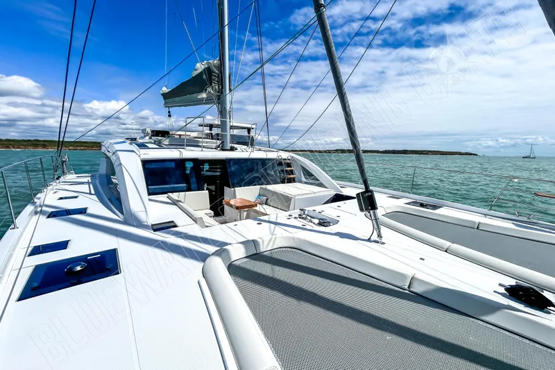 Fun Pass Yacht Photos Pics Luxury Privilege 580 yacht sailing on open sea, 2025 model, under clear blue skies.