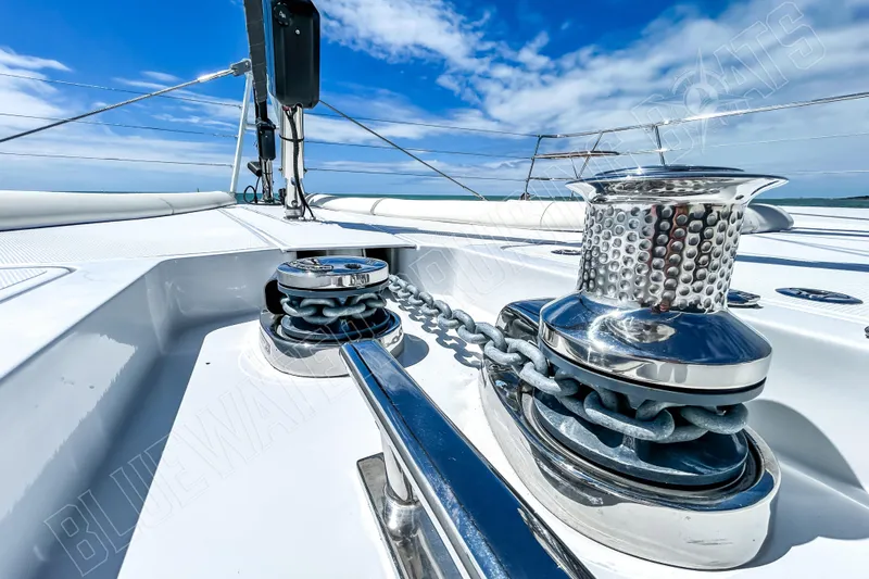 Fun Pass Yacht Photos Pics Close-up of a 2025 Privilege 580 yacht's deck with anchor chain and winch.