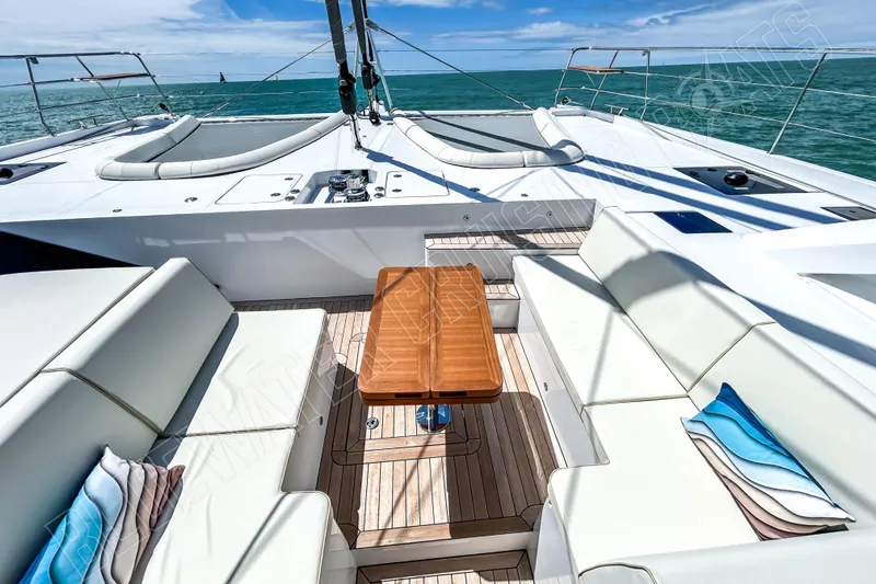 Fun Pass Yacht Photos Pics Luxurious 2025 Privilege 580 yacht deck with elegant seating and ocean view.