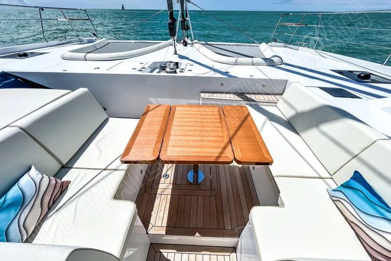 Fun Pass Yacht Photos Pics Luxurious Privilege 580 yacht deck with elegant seating and ocean view, 2025 model.