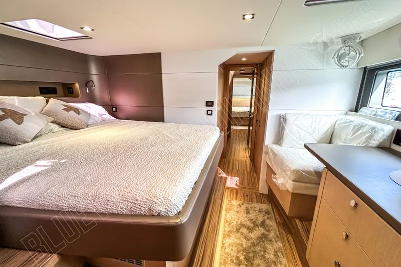 Fun Pass Yacht Photos Pics Luxurious interior of 2025 Privilege 580 yacht with cozy bedroom and modern design.