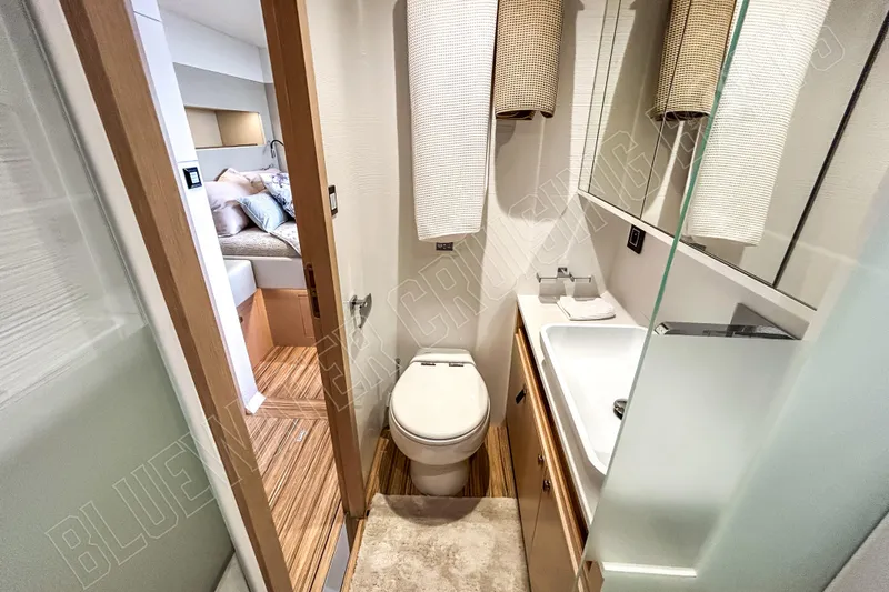 Fun Pass Yacht Photos Pics Luxury bathroom in 2025 Privilege 580 yacht, featuring modern fixtures and elegant design.