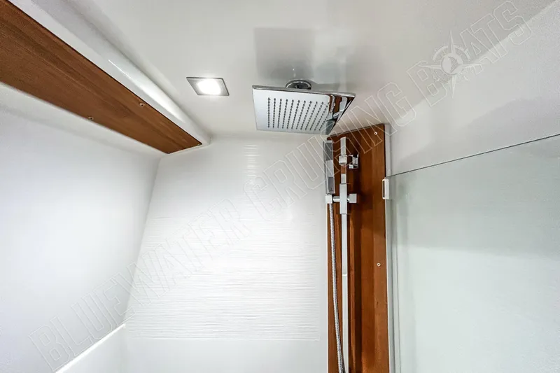 Fun Pass Yacht Photos Pics Modern shower in 2025 Privilege 580 yacht, featuring sleek design and wood accents.