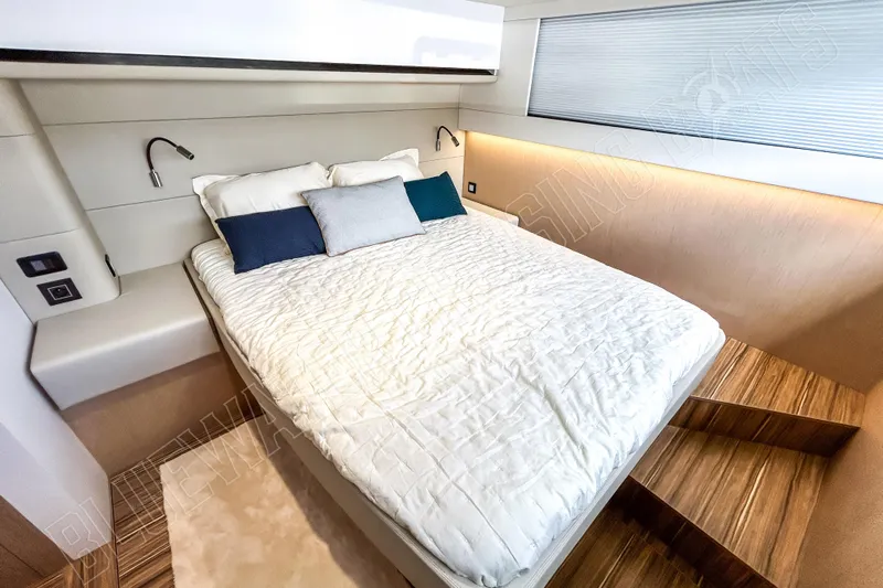 Fun Pass Yacht Photos Pics Luxurious bedroom interior of 2025 Privilege 580 yacht with modern design and cozy bedding.