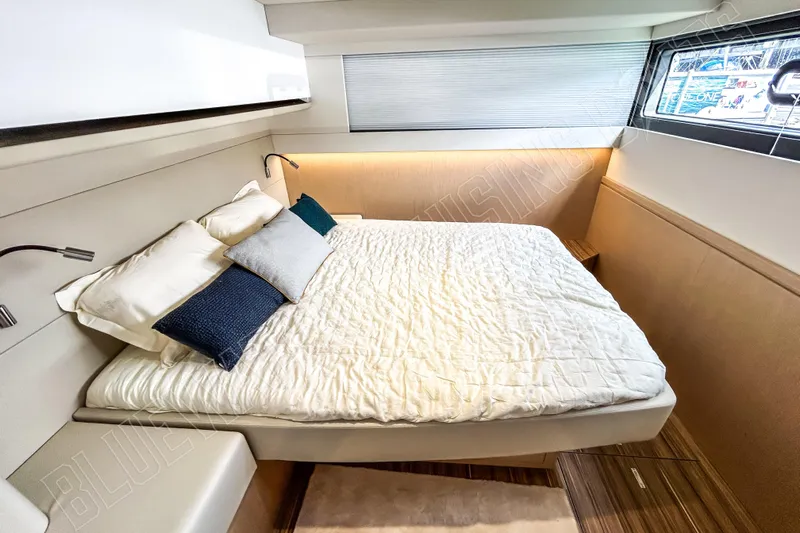 Fun Pass Yacht Photos Pics Luxurious bedroom interior of 2025 Privilege 580 yacht with modern design and cozy bedding.