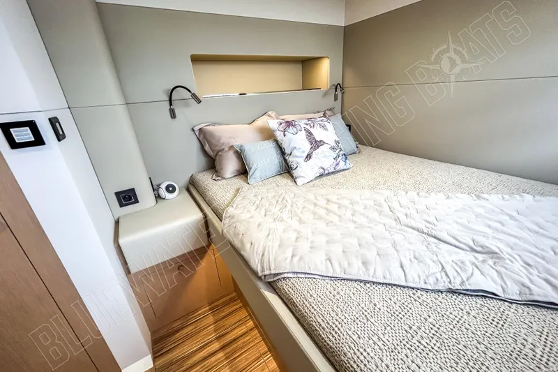 Fun Pass Yacht Photos Pics Luxurious bedroom interior of 2025 Privilege 580 yacht with elegant bedding and modern design.