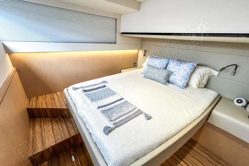 Fun Pass Yacht Photos Pics Luxurious cabin interior of 2025 Privilege 580 yacht with cozy bedding and modern design.