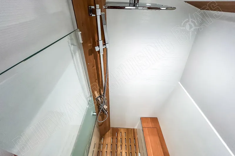 Fun Pass Yacht Photos Pics Modern shower area in 2025 Privilege 580 yacht, featuring sleek design and wooden accents.