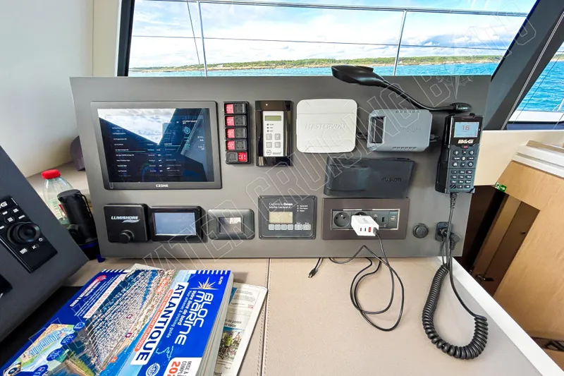 Fun Pass Yacht Photos Pics Control panel of 2025 Privilege 580 yacht with navigation and communication equipment.