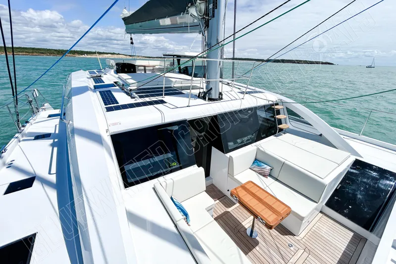 Fun Pass Yacht Photos Pics Luxury Privilege 580 yacht deck with seating, solar panels, and ocean view, 2025 model.