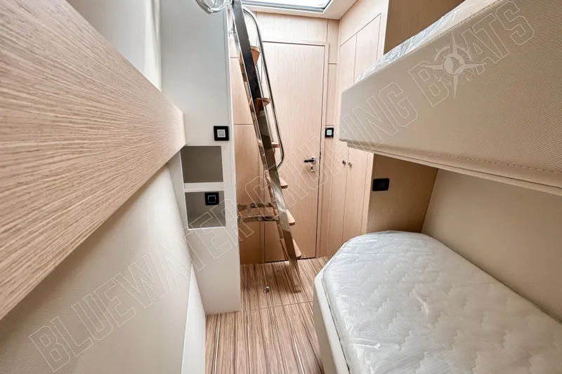 Fun Pass Yacht Photos Pics Interior of 2025 Privilege 580 yacht with wooden finishes and bunk beds.