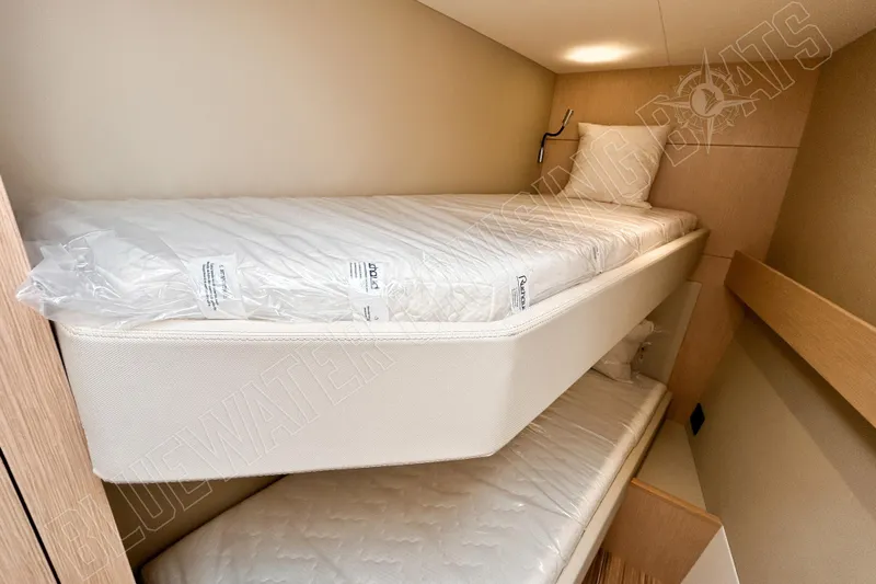 Fun Pass Yacht Photos Pics Bunk beds in 2025 Privilege 580 yacht cabin, featuring modern design and comfortable mattresses.