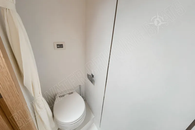 Fun Pass Yacht Photos Pics Compact bathroom in 2025 Privilege 580 yacht with modern toilet and minimalist design.