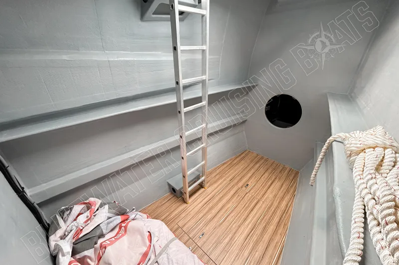 Fun Pass Yacht Photos Pics Interior of 2025 Privilege 580 yacht with ladder, wooden floor, and nautical equipment.