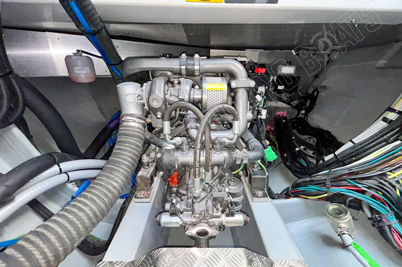 Fun Pass Yacht Photos Pics Engine compartment of 2025 Privilege 580 yacht, showcasing intricate wiring and components.