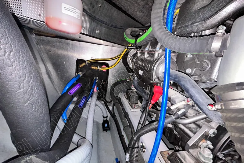 Fun Pass Yacht Photos Pics Engine compartment of 2025 Privilege 580 yacht with visible wiring and components.