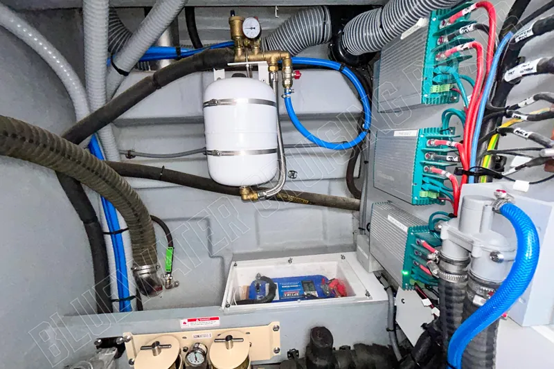 Fun Pass Yacht Photos Pics Engine room of 2025 Privilege 580 yacht, showcasing complex wiring and plumbing systems.