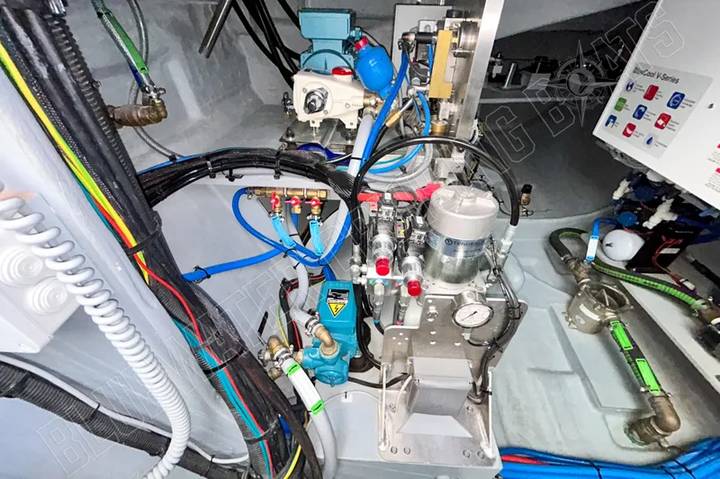 Fun Pass Yacht Photos Pics Engine room of 2025 Privilege 580 yacht with complex wiring and machinery.