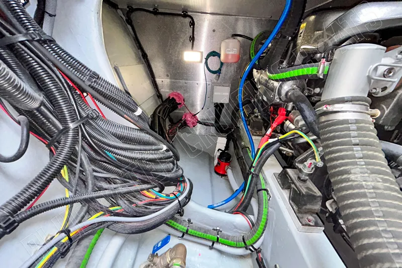 Fun Pass Yacht Photos Pics Engine compartment of 2025 Privilege 580 with complex wiring and hoses.
