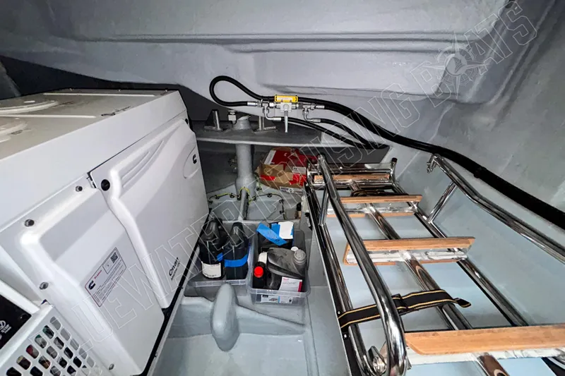 Fun Pass Yacht Photos Pics Engine room of 2025 Privilege 580 yacht with equipment and storage.