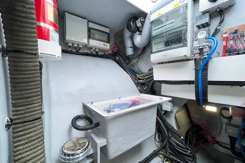 Fun Pass Yacht Photos Pics Electrical compartment of 2025 Privilege 580 yacht with wiring and control panels.
