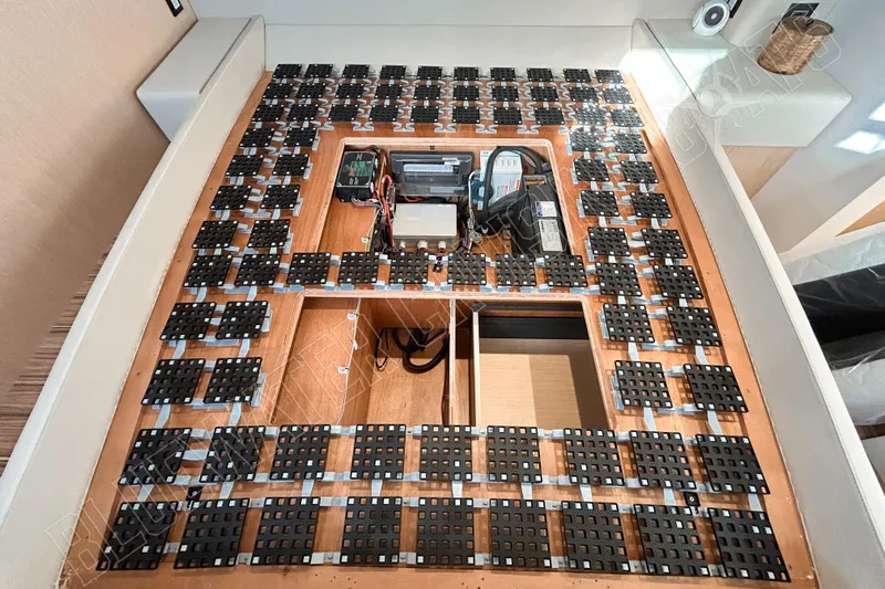 Fun Pass Yacht Photos Pics Interior view of Privilege 580 yacht, showcasing advanced under-bed storage system, 2025 model.