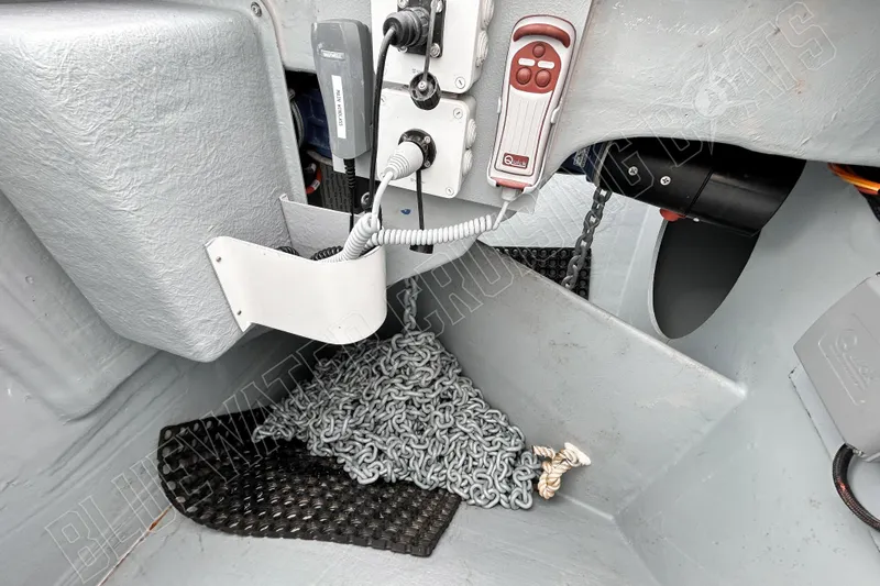 Fun Pass Yacht Photos Pics 2025 Privilege 580 yacht interior with control panel and anchor chain storage.