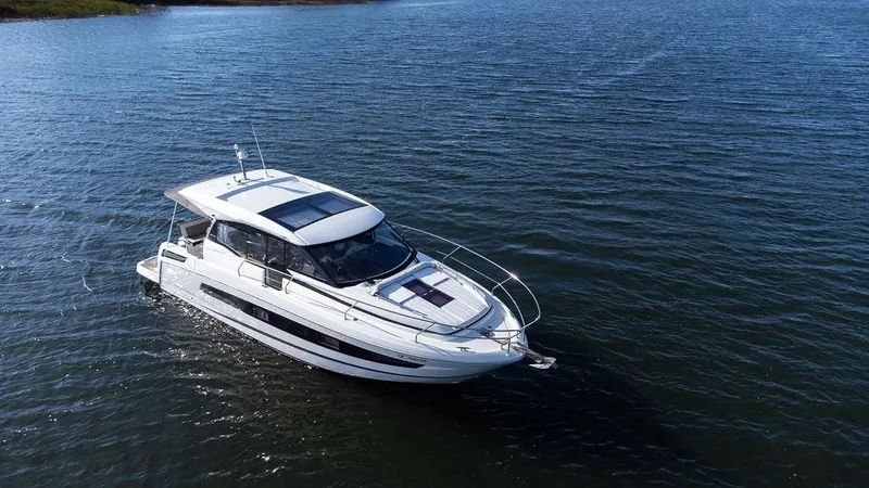  Yacht Photos Pics 2021 Jeanneau NC 37 boat cruising on calm waters.