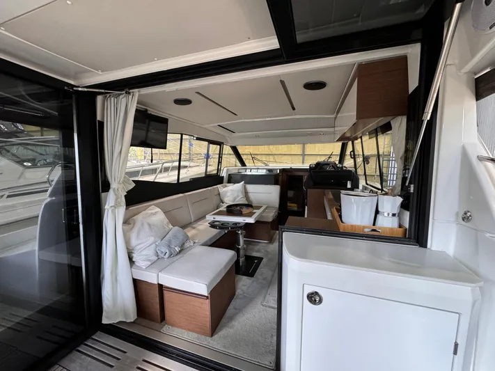  Yacht Photos Pics Interior of 2021 Jeanneau NC 37 yacht, featuring modern seating and elegant design.