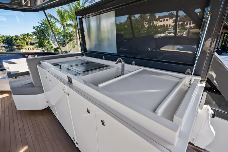 Sunsation Yacht Photos Pics Luxurious outdoor kitchen on 2019 Ferretti Yachts 780, featuring sleek countertops and modern amenities.