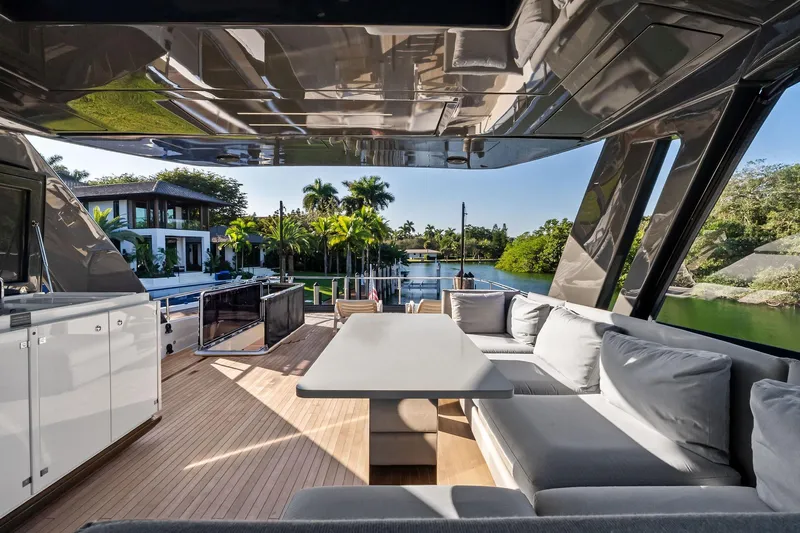 Sunsation Yacht Photos Pics Luxurious 2019 Ferretti Yachts 780 interior with elegant seating and scenic waterfront view.