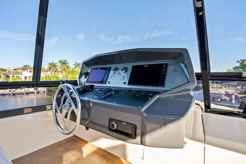 Sunsation Yacht Photos Pics Helm of 2019 Ferretti Yachts 780 with modern navigation equipment and scenic view.