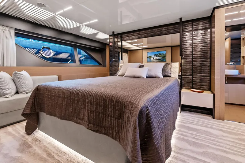 Sunsation Yacht Photos Pics Luxurious bedroom interior of 2019 Ferretti Yachts 780, featuring modern design and elegant furnishings.