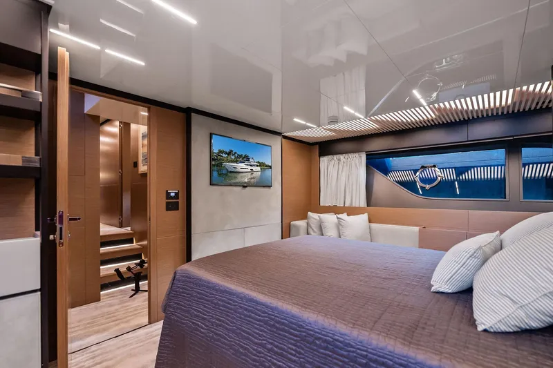 Sunsation Yacht Photos Pics Luxurious interior of 2019 Ferretti Yachts 780, featuring elegant bedroom design.