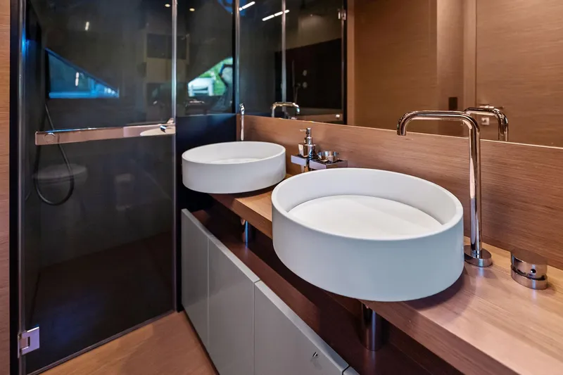 Sunsation Yacht Photos Pics Luxurious bathroom in 2019 Ferretti Yachts 780, featuring modern dual sinks and elegant fixtures.