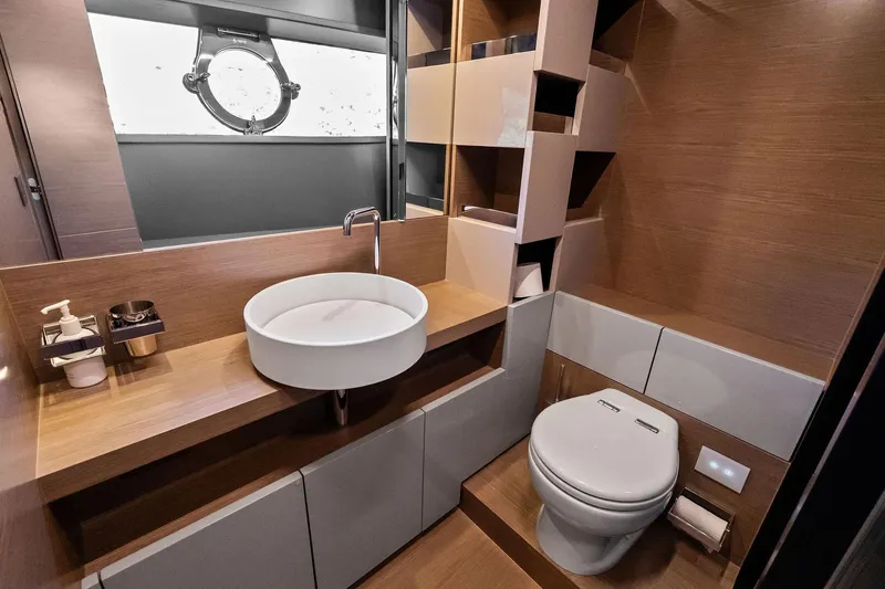 Sunsation Yacht Photos Pics Luxurious bathroom in 2019 Ferretti Yachts 780, featuring modern sink and toilet design.
