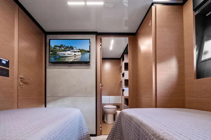 Sunsation Yacht Photos Pics Luxurious 2019 Ferretti Yachts 780 cabin interior with twin beds and modern amenities.