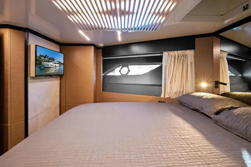 Sunsation Yacht Photos Pics Luxurious bedroom interior of 2019 Ferretti Yachts 780 with modern design and elegant lighting.