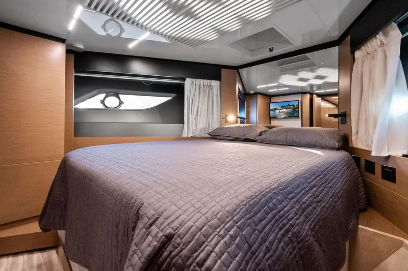 Sunsation Yacht Photos Pics Luxurious bedroom interior of 2019 Ferretti Yachts 780 with modern design and elegant bedding.