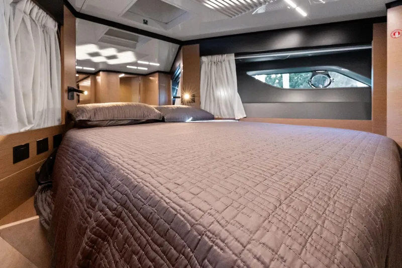 Sunsation Yacht Photos Pics Luxurious bedroom interior of 2019 Ferretti Yachts 780 with elegant bedding and modern design.