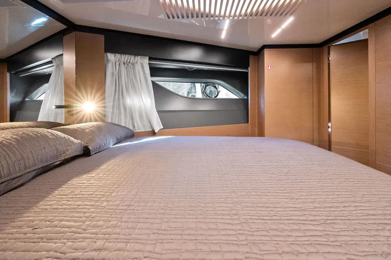 Sunsation Yacht Photos Pics Luxurious bedroom interior of 2019 Ferretti Yachts 780 with modern design and elegant lighting.