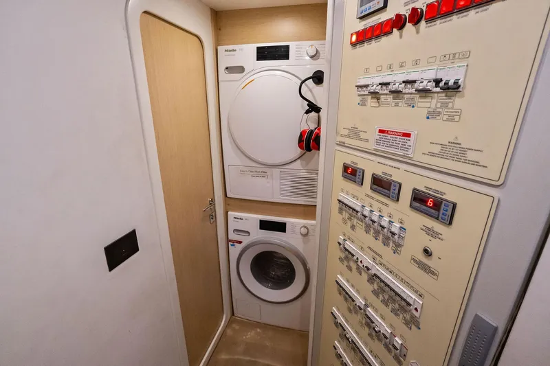 Sunsation Yacht Photos Pics Laundry and control panel area on a 2019 Ferretti Yachts 780.