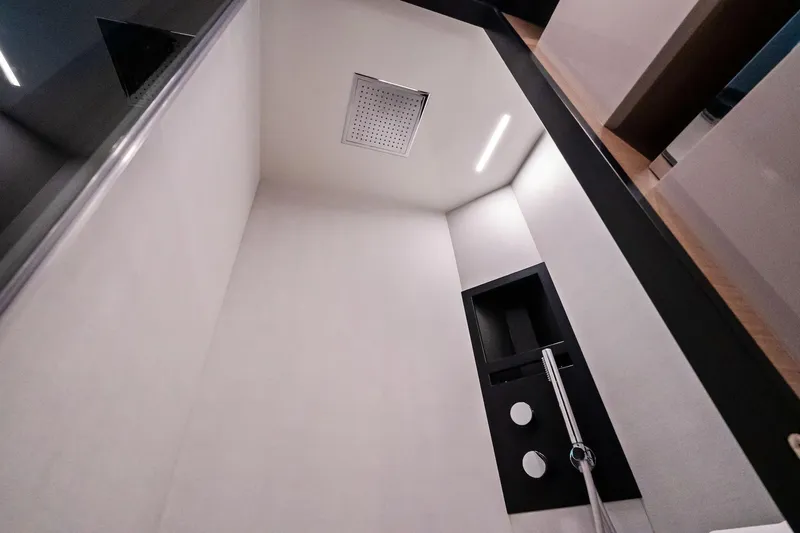 Sunsation Yacht Photos Pics Modern shower interior on 2019 Ferretti Yachts 780, featuring sleek design and fixtures.