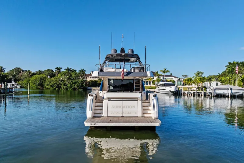 Sunsation Yacht Photos Pics 2019 Ferretti Yachts 780 docked in a serene marina setting.
