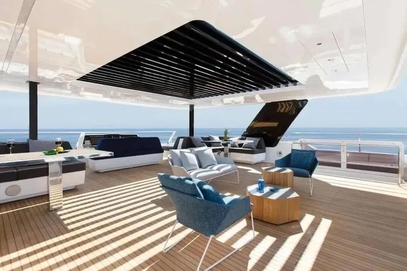 Yacht Photos Pics Luxurious Sunreef 80 Power yacht deck, 2021 model, featuring elegant seating and ocean views.