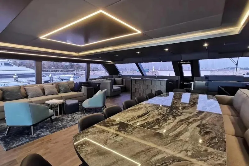  Yacht Photos Pics Luxurious interior of 2021 Sunreef 80 Power yacht with modern furnishings and elegant lighting.