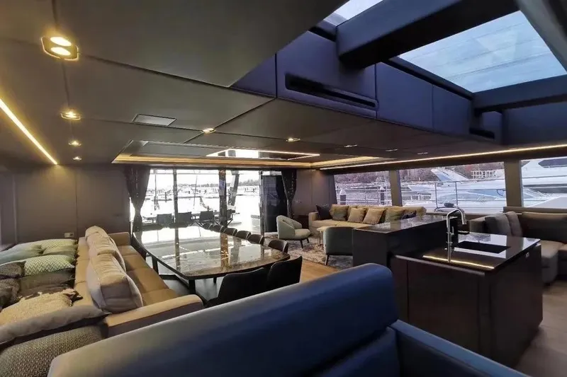  Yacht Photos Pics Luxurious interior of 2021 Sunreef 80 Power yacht with modern furnishings and large windows.