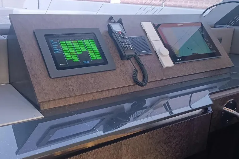  Yacht Photos Pics Control panel of 2021 Sunreef 80 Power yacht with navigation screens and communication device.