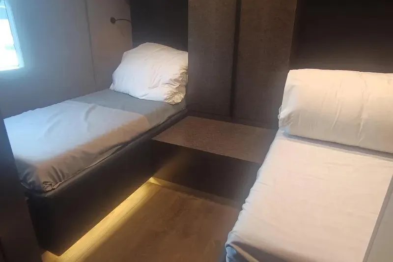  Yacht Photos Pics Twin cabin beds in 2021 Sunreef 80 Power yacht, featuring modern design and ambient lighting.