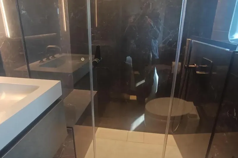  Yacht Photos Pics Luxurious bathroom interior on 2021 Sunreef 80 Power yacht with modern fixtures and elegant design.